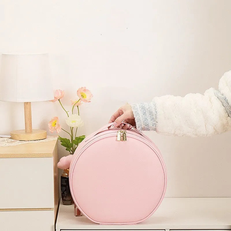 Round cherry blossom pink PU leather makeup bag with built-in LED mirror and internal partitions.