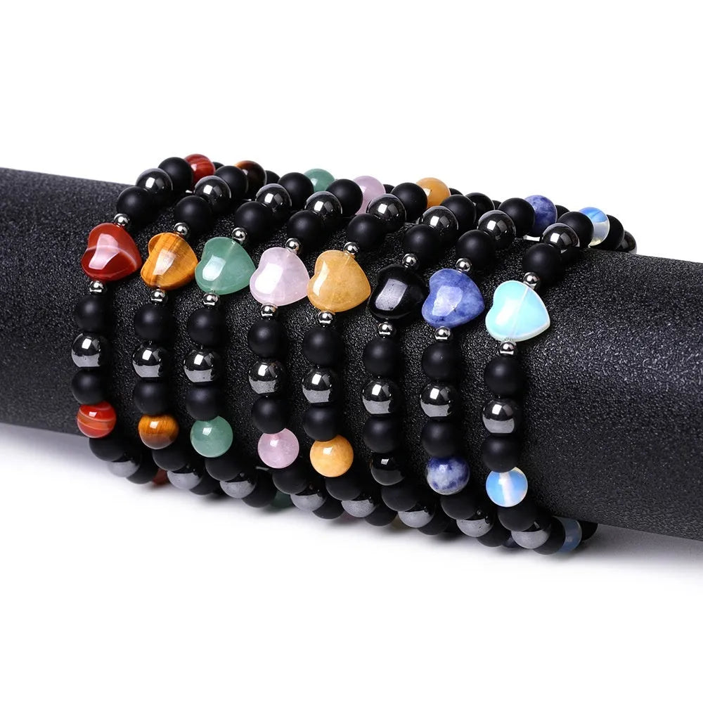 Hand-cut peach heart stone bracelet with geometric moon planet design in Tigereye colour