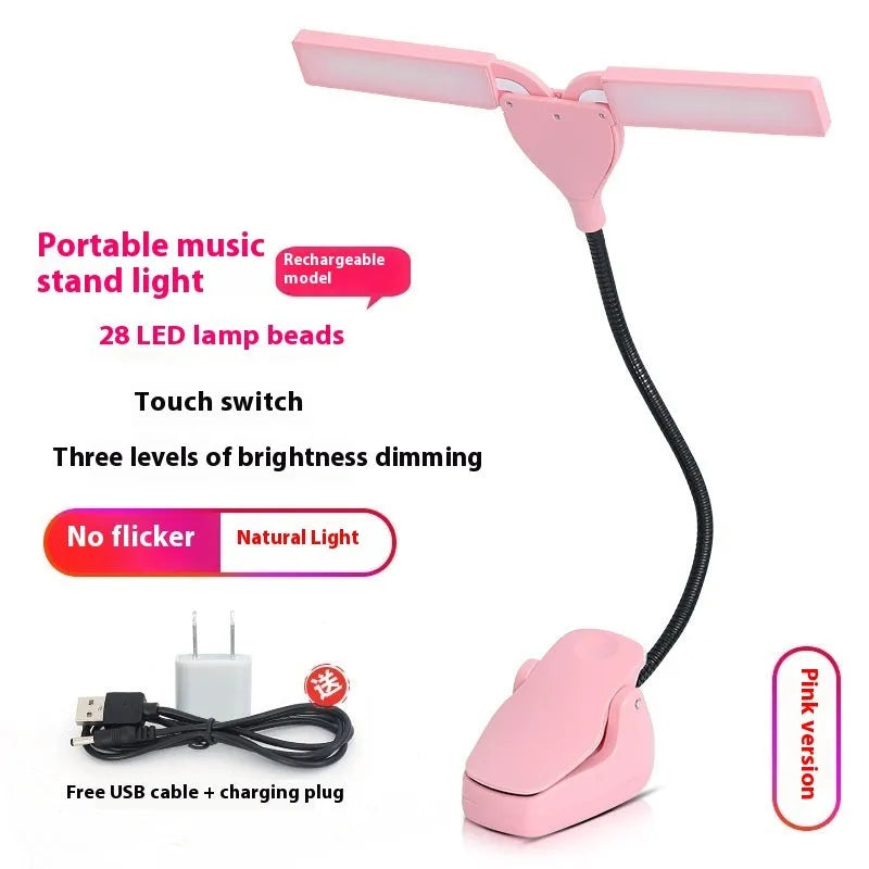 Black rechargeable music stand lamp with 28 soft white LEDs clipped to a metal music stand.