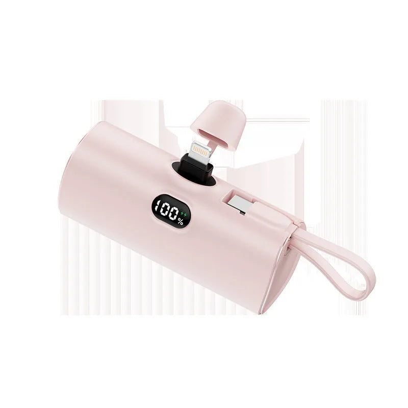 Capsule-shaped digital display power bank in multiple colours showing its size and built-in plug.