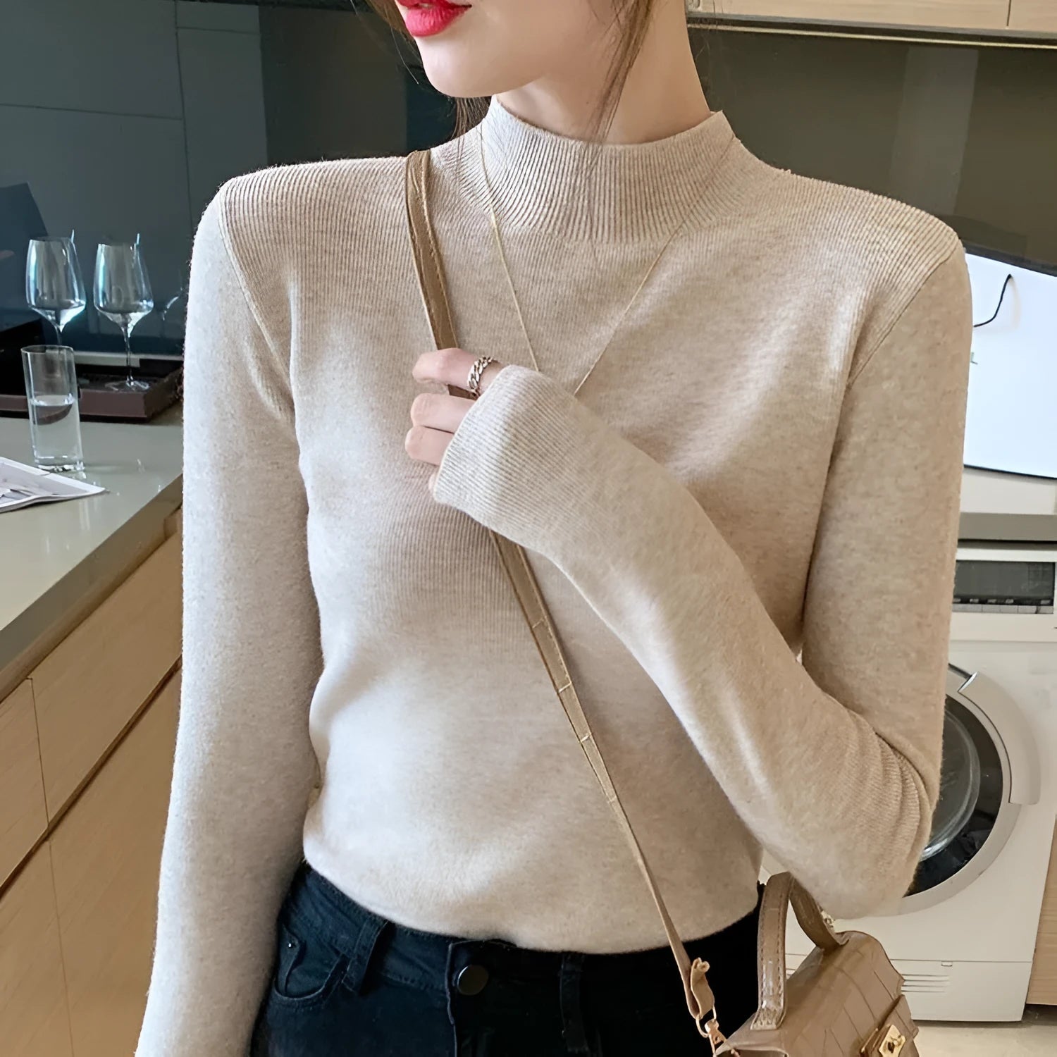 Slim fit knitted viscose bottoming shirt in apricot colour with long sleeves.