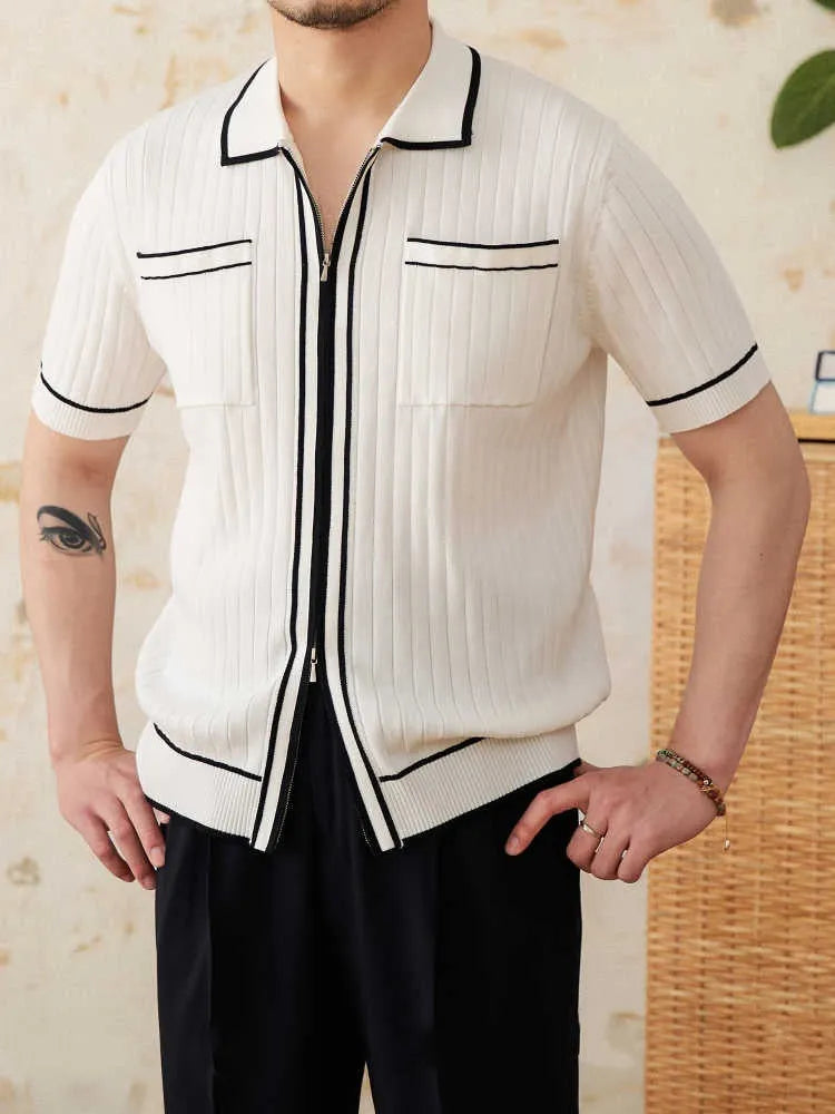 Slim black elastic knit polo shirt with a lapel collar and short sleeves on a hanger.