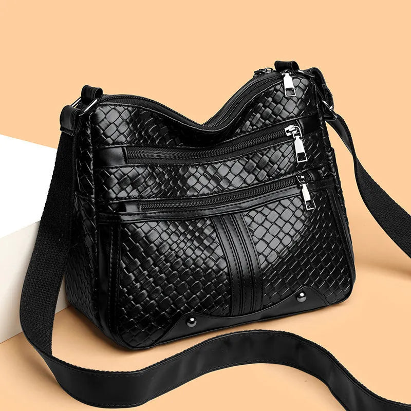 Woven PU messenger bag with single shoulder strap showing horizontal square shape and multiple compartments