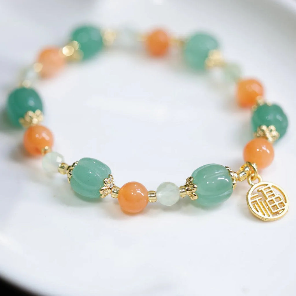 Traditional Chinese Duobao pumpkin bracelet with Jinsi Jade barrel beads and Fuka hanging charm