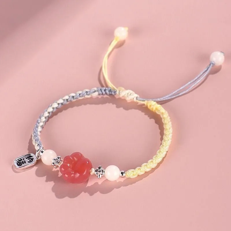 Handmade red cat's paw charm bracelet woven with pink or yellow glass beads in a pastoral couple's style.