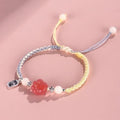 Handmade red cat's paw charm bracelet woven with pink or yellow glass beads in a pastoral couple's style.