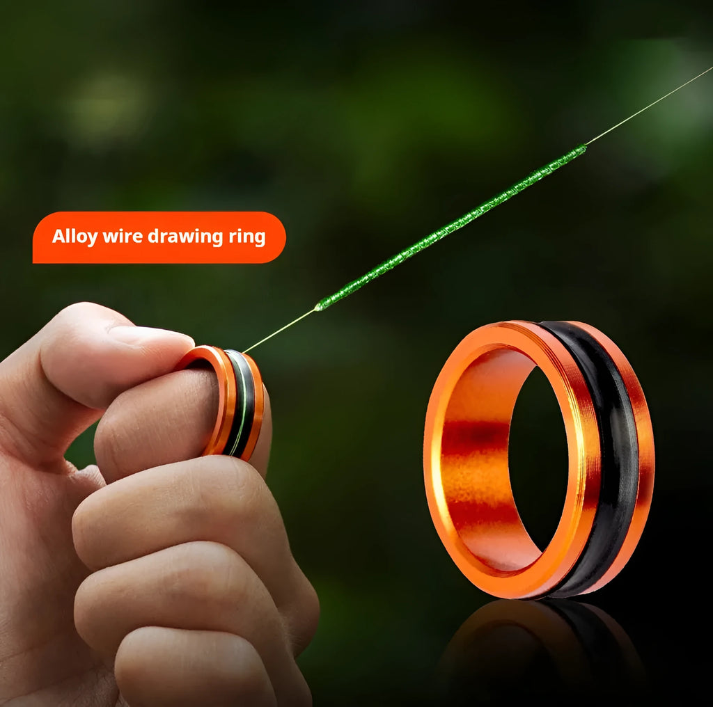 Orange and silver alloy fishing hand guard tool with a pull loop for hook removal.