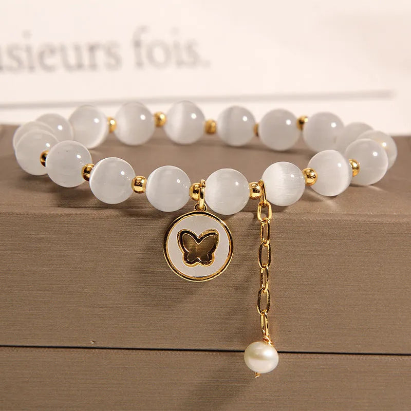 White cat's eye crystal geometric bracelet with adjustable clasp for women.