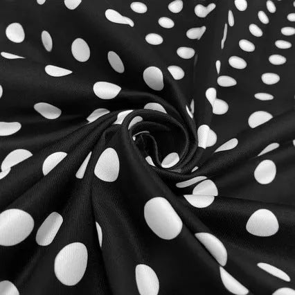 Multicolour polka dot dress with square neckline, short sleeves, front zip, and a pleated midi skirt.