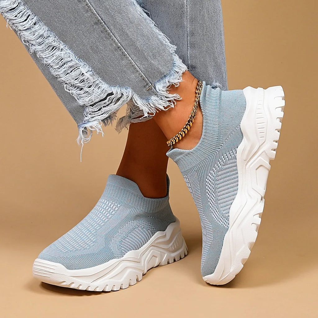 Light blue women's mesh slip-on sports shoes with woven design and round toe