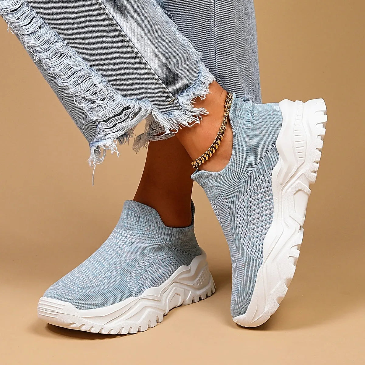 Light blue women's mesh slip-on sports shoes with woven design and round toe
