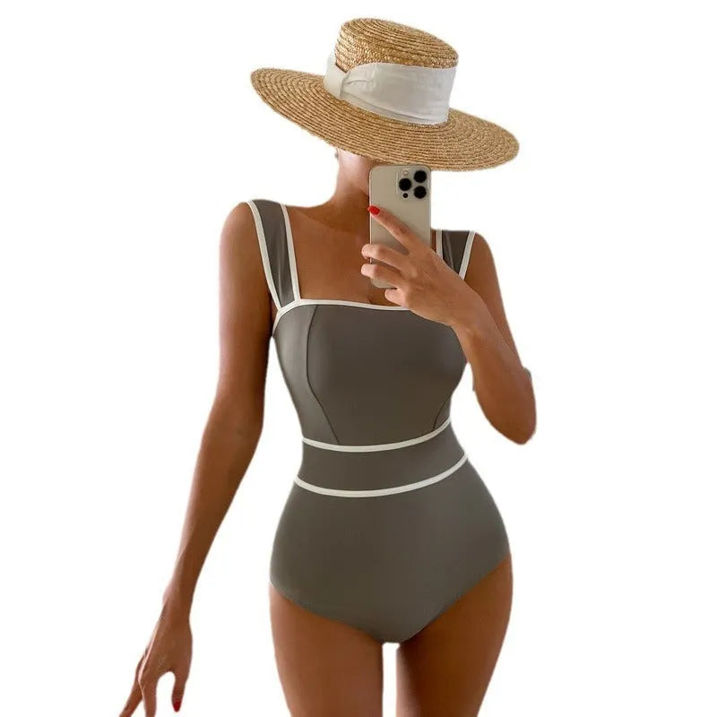 Women's black one-piece swimsuit with a lace-up back, shown from the rear.