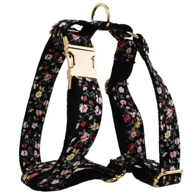 Four-piece pet accessory set with dog collar, leash, removable bow, and printed vest in cloth material