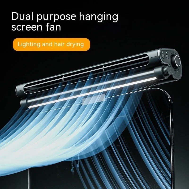 Black USB-powered bladeless fan with clip and integrated desk lamp attached to a laptop screen.