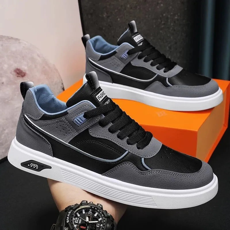 Men's low-top canvas board shoes in grey with leather stitching and mesh lining visible at the collar.