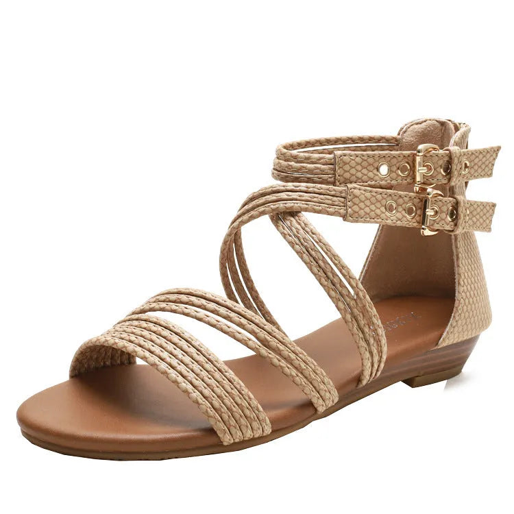 Women's light green cross-strap Roman sandals with a thick wedge sole and back zipper.