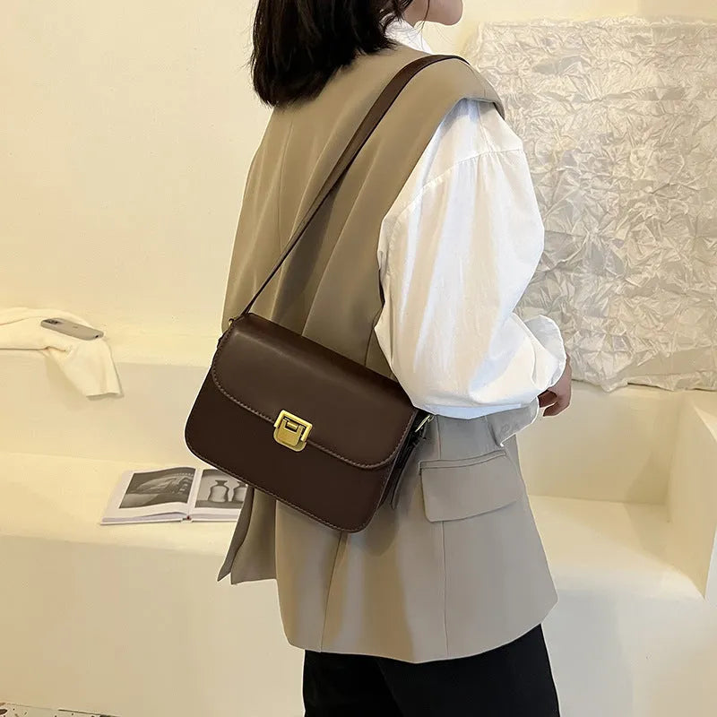 Soft PU leather women's cross-body bag with textured finish in horizontal square silhouette