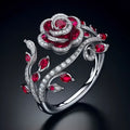 Silver ring with interwoven leaf pattern and red zircon stone