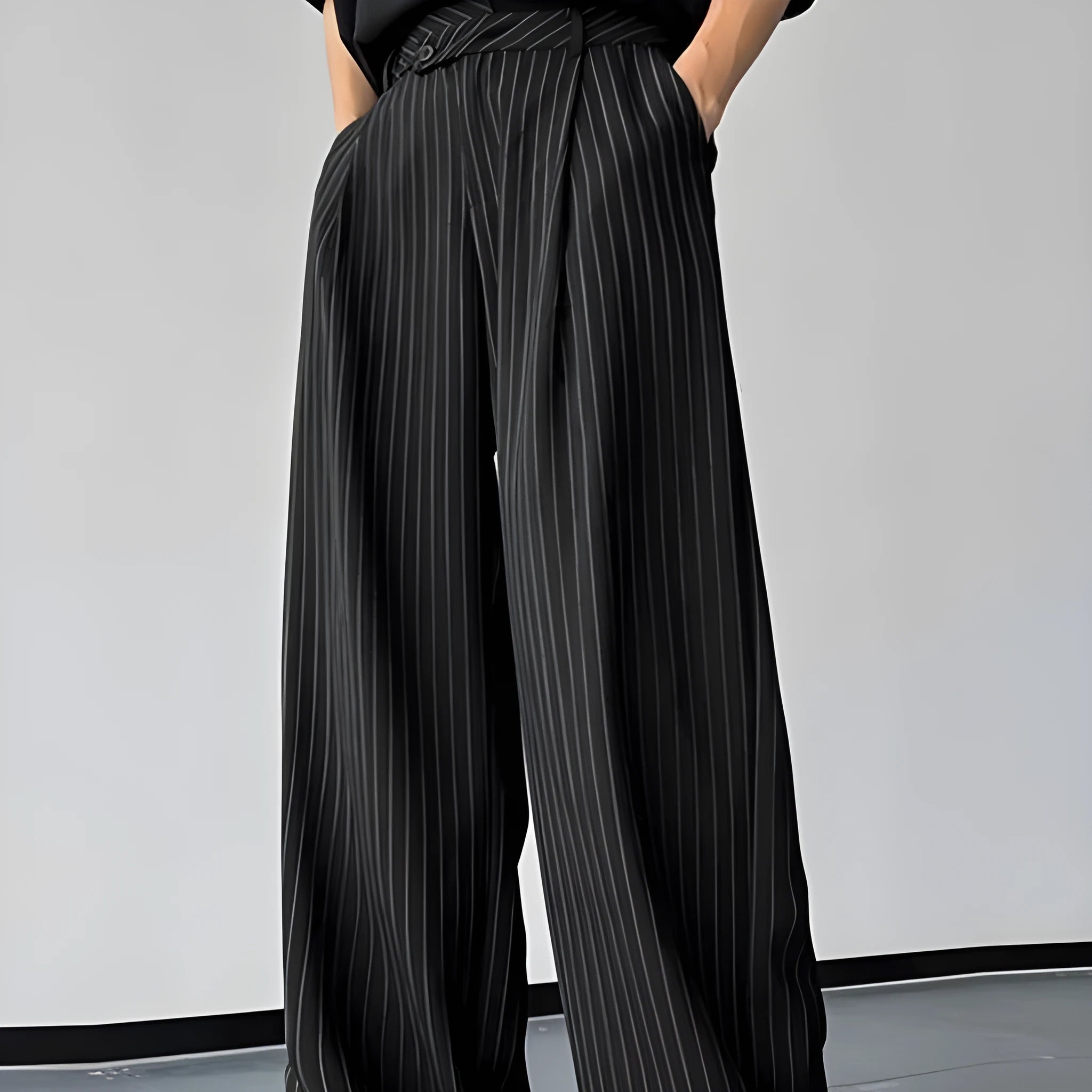 Men's black vertical striped pleated casual trousers showing front and side views