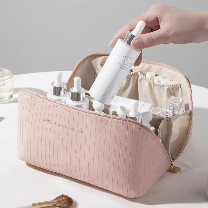 Vertical pattern cubic PU makeup bag in beige, showing large capacity for travel storage.