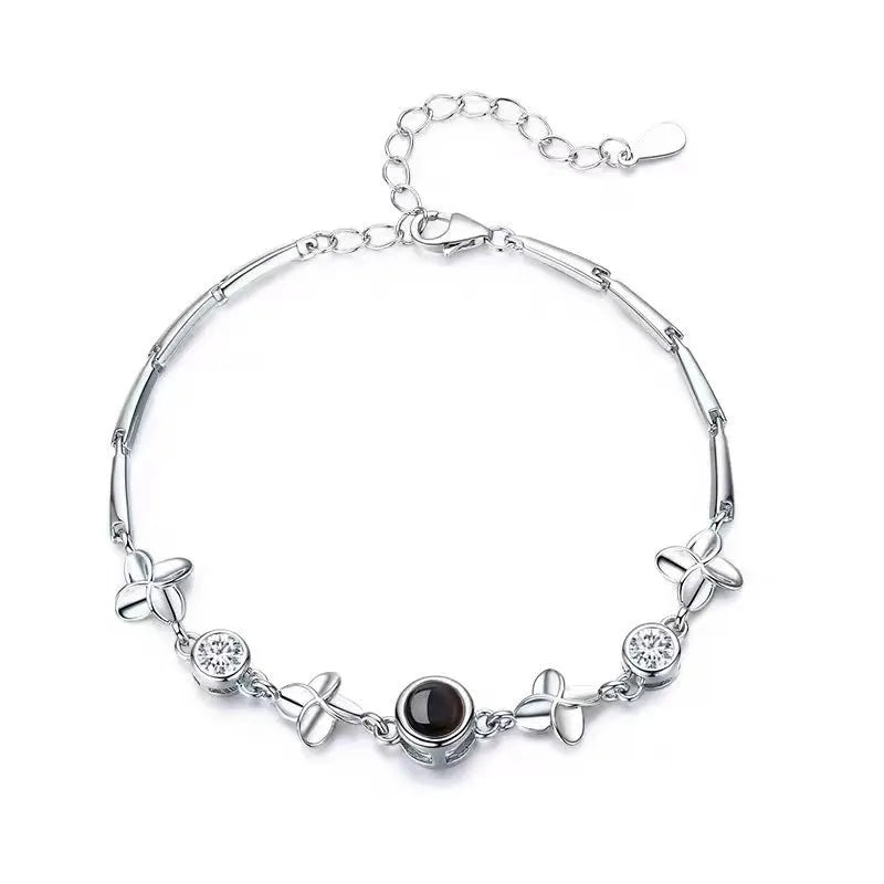 Women's sterling silver projection photo bracelet with white leaf and flower design and diamond-cut finish