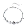 Women's sterling silver projection photo bracelet with white leaf and flower design and diamond-cut finish