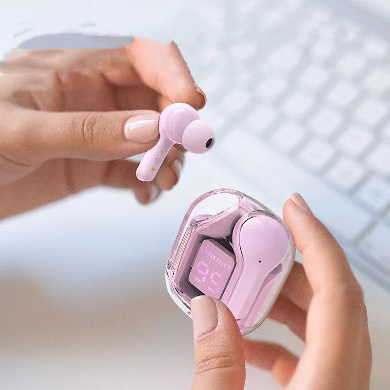 Mini wireless Bluetooth headset with LED display shown in green, next to its silicone case and USB-C charging cable.