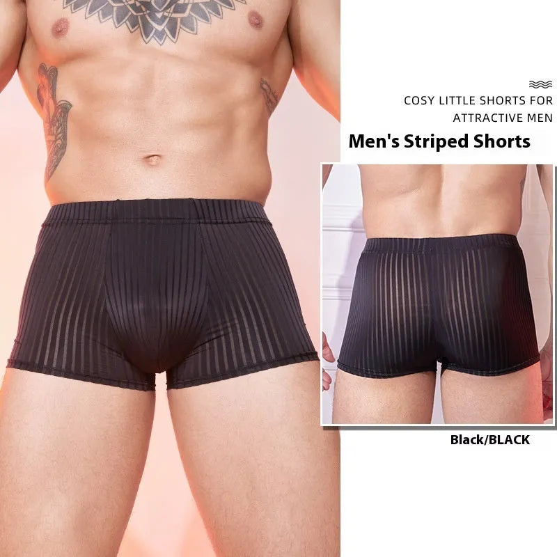 Men's black and white striped low-rise nylon underwear on a plain background.