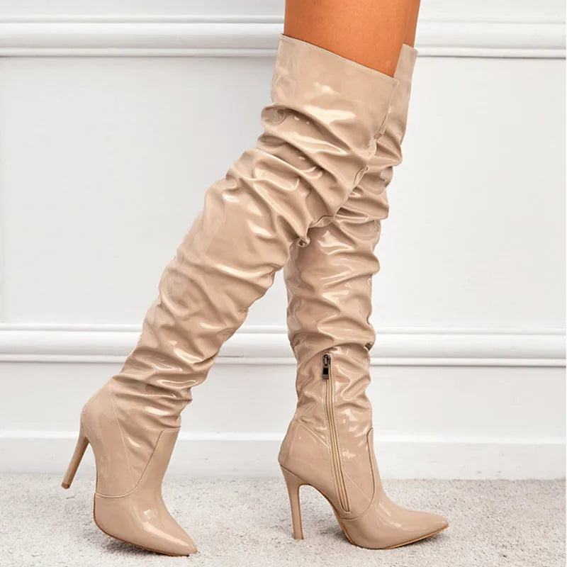 Women's knee high super high heel boots with side zipper, pointy toe, and leather stitching detail in solid colour