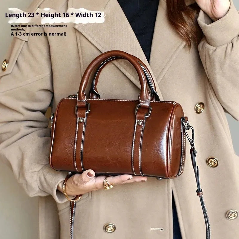 Cortex lady casual zip crossbody bag in top grain leather, cylindrical shape, shown in available colours
