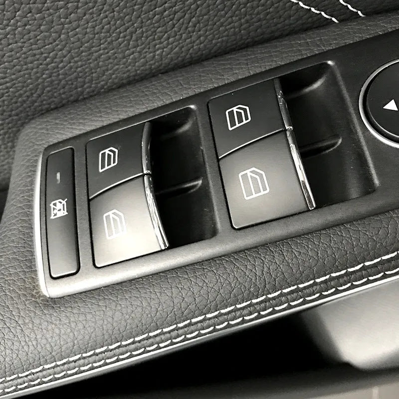 Black ABS plastic self-adhesive decorative sticker for a car window lift button.
