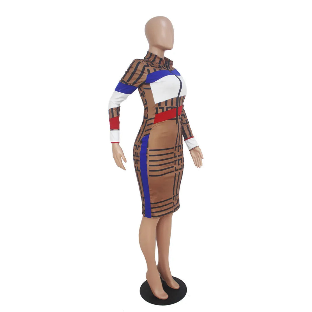 Multicolor mosaic geometry pattern long sleeve printed dress with zipper closure on a woman against a white background.
