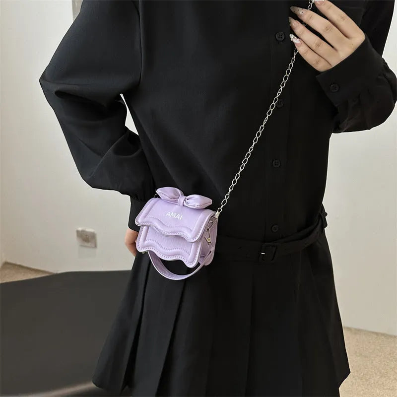 Mini crossbody bag in PU material with adjustable strap available in seven colours