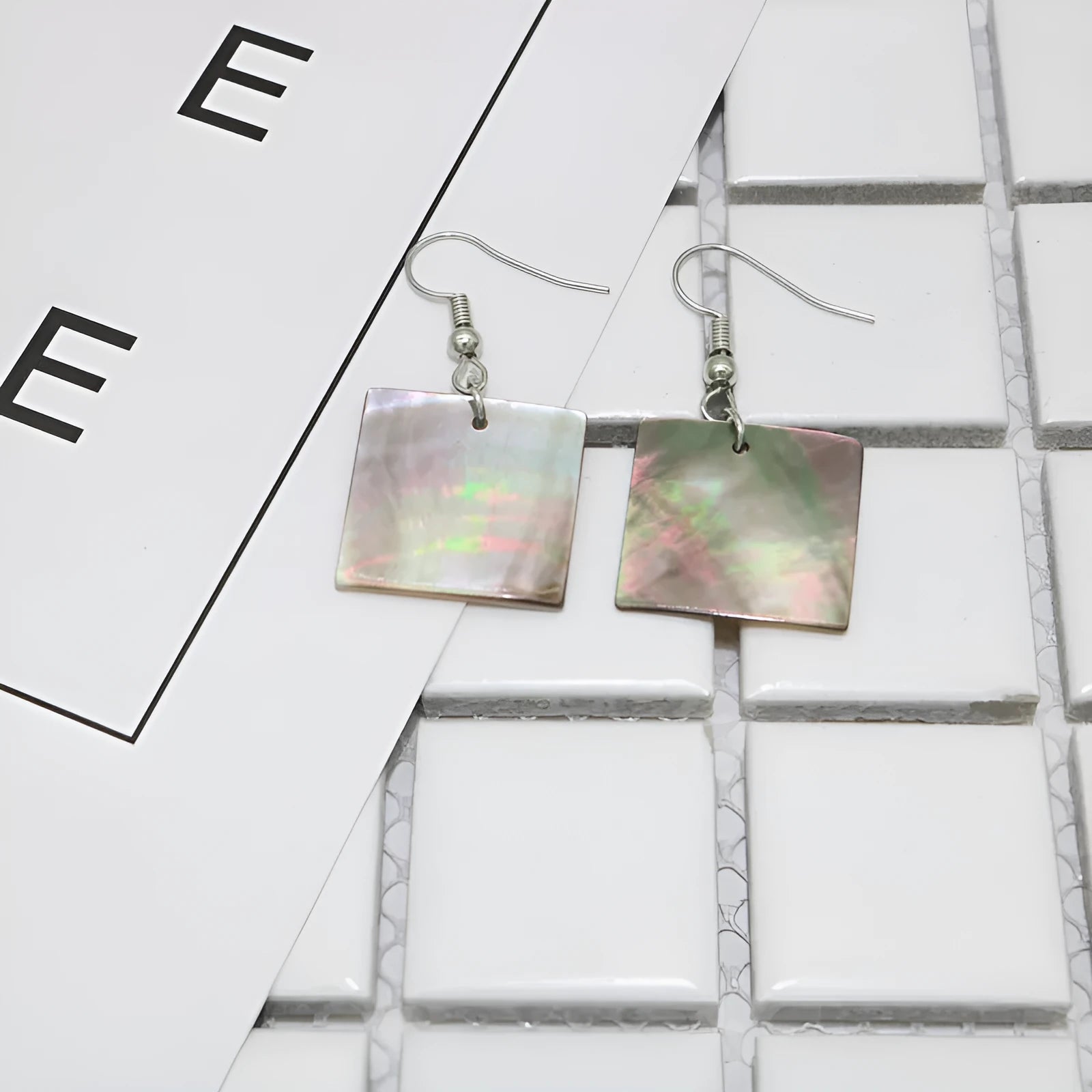 Women's natural shell earrings in geometric square and rectangular shapes with retro styling