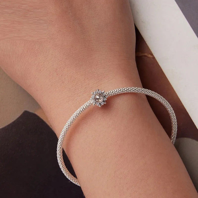 S925 sterling silver sunflower spacer bead with silicone positioning, 0.9cm height and width, 0.45cm aperture, on white background
