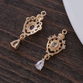 Small hollow water drop-shaped copper pendant with micro inlaid zircon detailing.