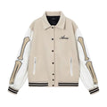 Women's apricot woollen jacket with white bone embroidery on the front.