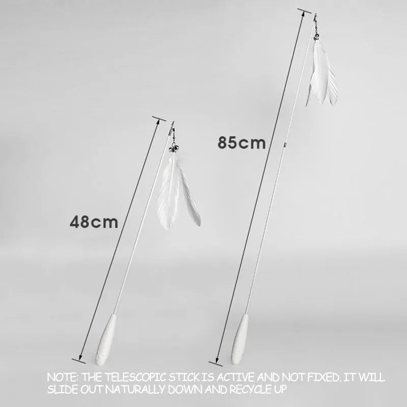 White telescopic fishing rod cat toy extended, with goose feather attachments and a small bell, on a neutral background.