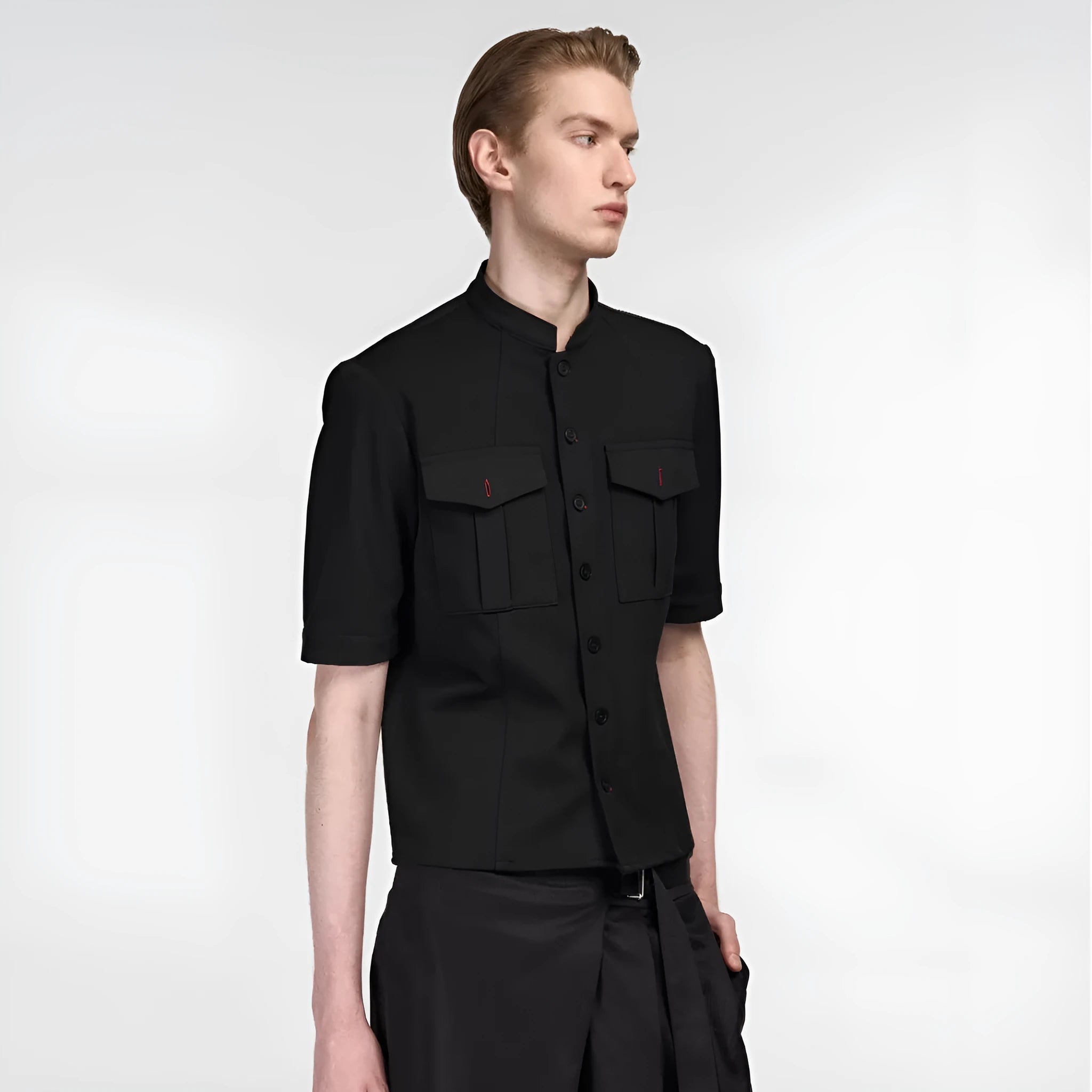 Handmade black loose fit half sleeve shirt with a shirt collar on a hanger.