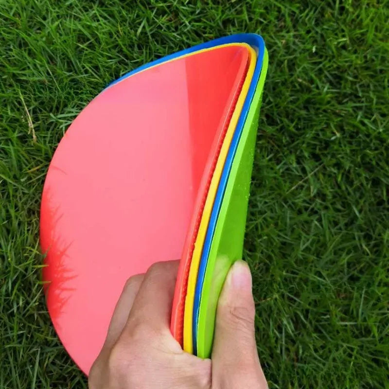 Yellow 23cm diameter flat TPE football training marker disc on grass