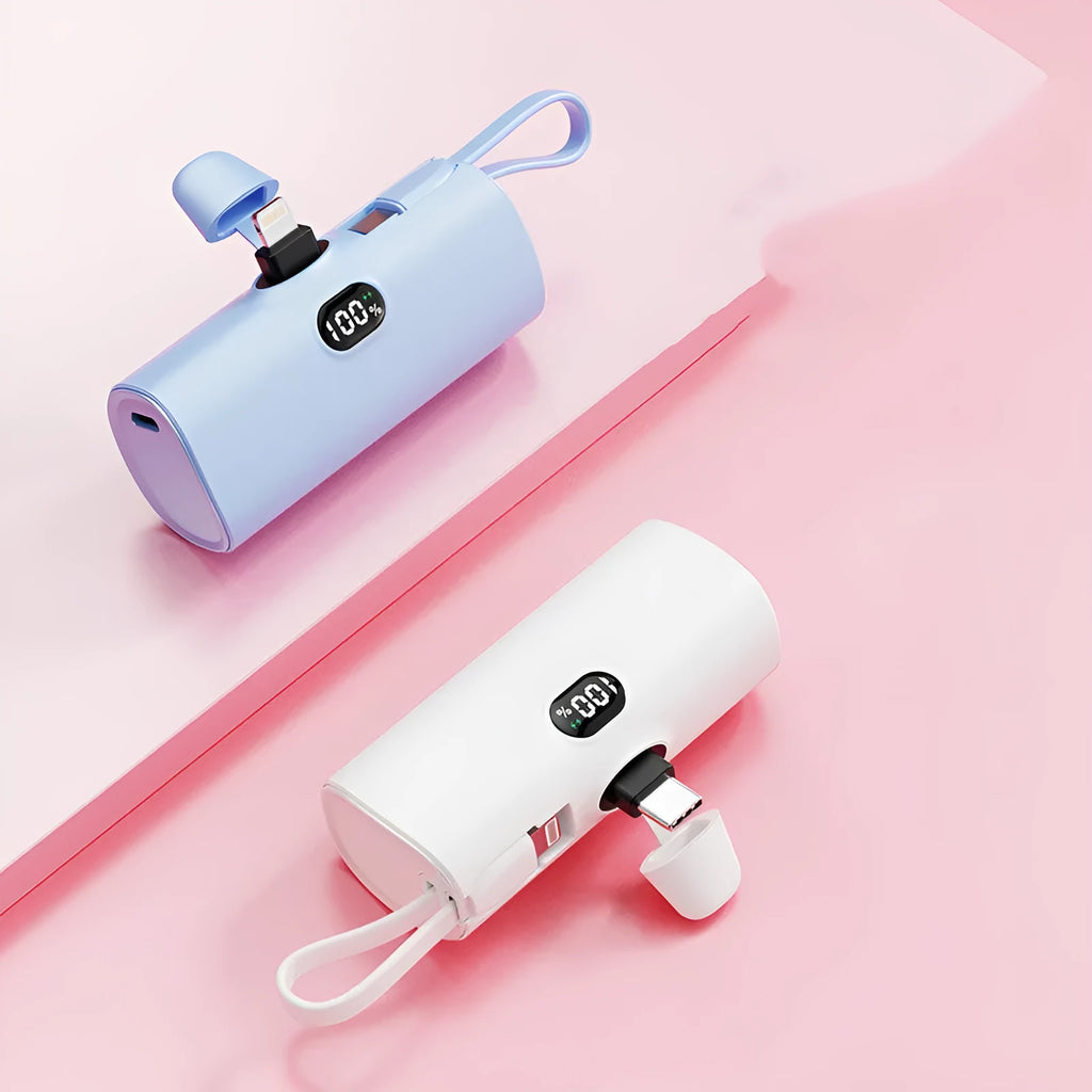 Capsule-shaped wireless power bank with digital display and integrated plug, shown in multiple colours.