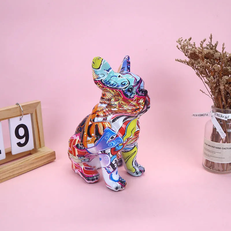 Graffiti-coloured French Bulldog resin statue on display surface