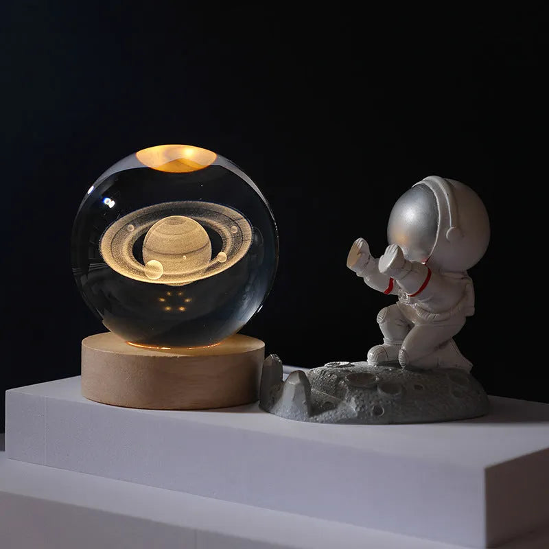 Luminous crystal ball night light on round wooden base with optional astronaut push, 6cm or 8cm sphere