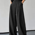 Men's black vertical striped pleated casual trousers showing front and side views