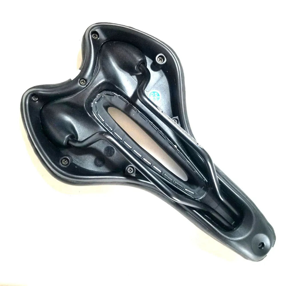 Universal bicycle saddle with grey PU leather top, shown alongside a waterproof cover, a silver 6mm wrench, and a box of tyre patches.