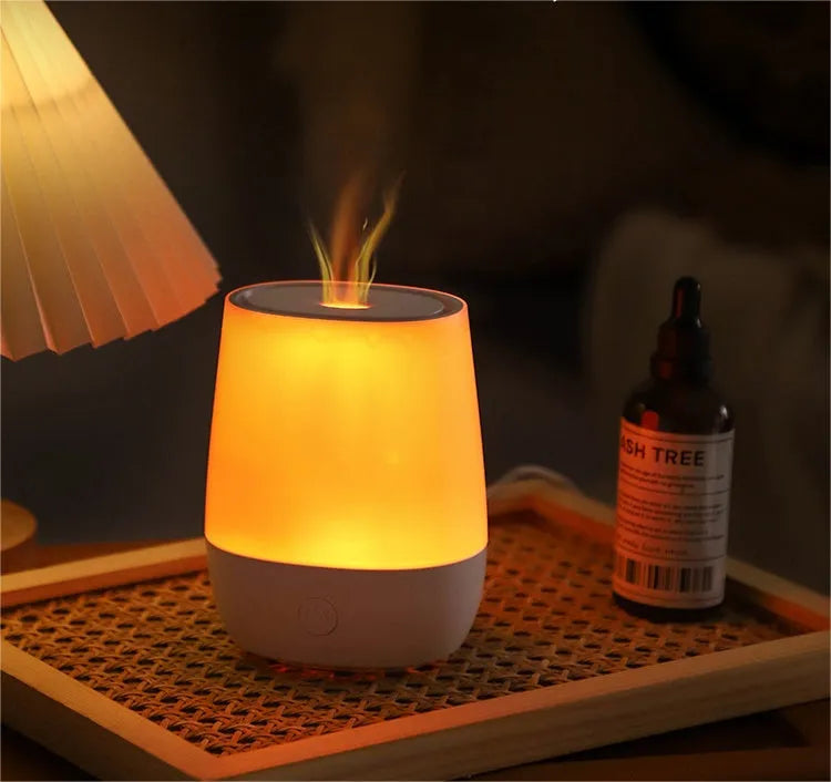 White USB aromatherapy diffuser with simulated flame effect showing mist output