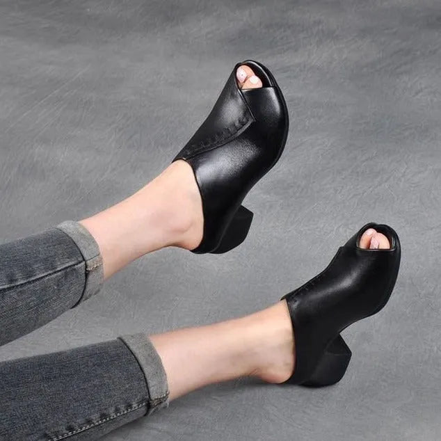Women's black peep-toe slipper with a square heel and fish mouth opening, shown on a white background.