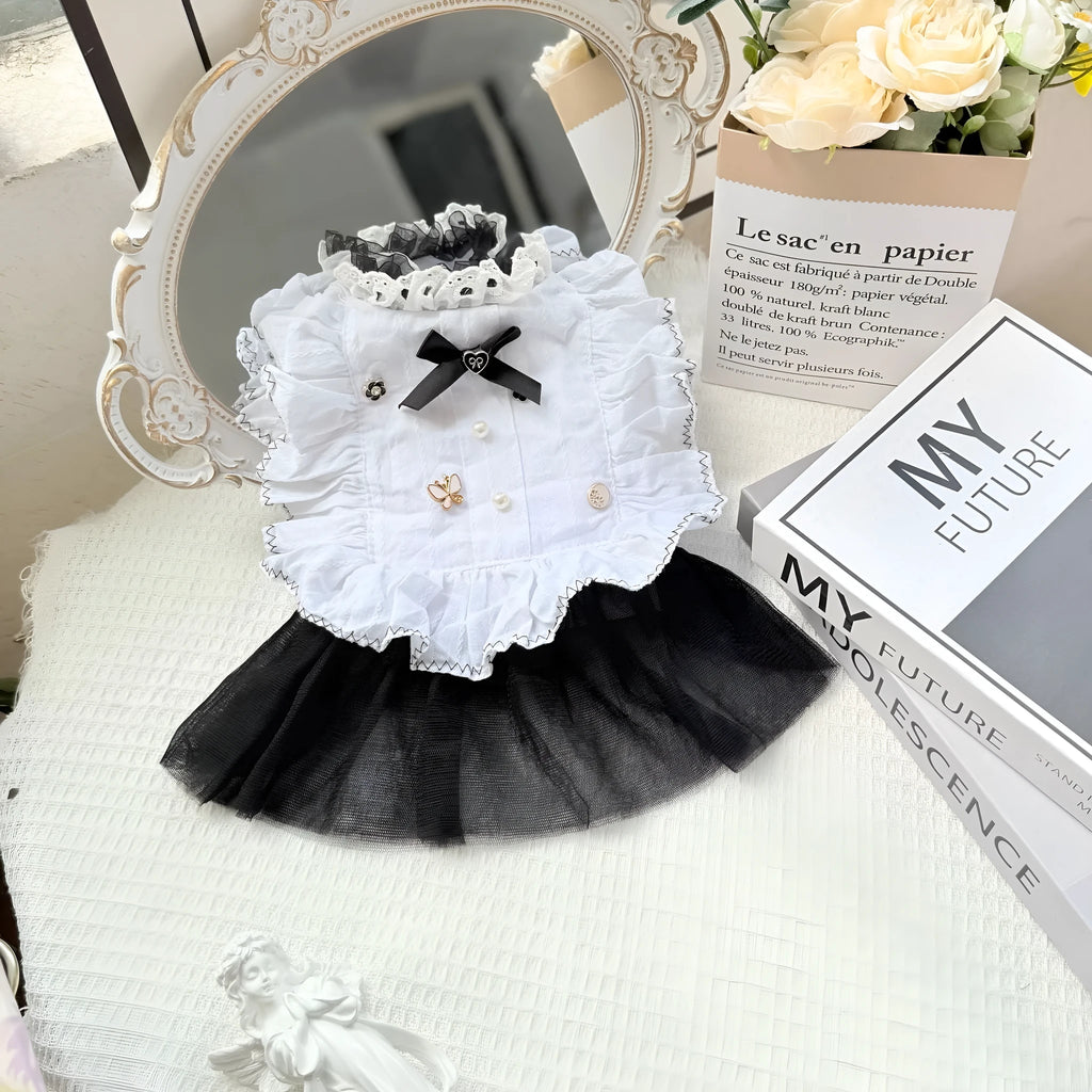 White princess-style dog dress with a gauze yarn skirt on a small dog, showing fit and style.