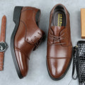 Men's black formal lace-up shoes with decorative stitching and horse buckle detail on rubber sole