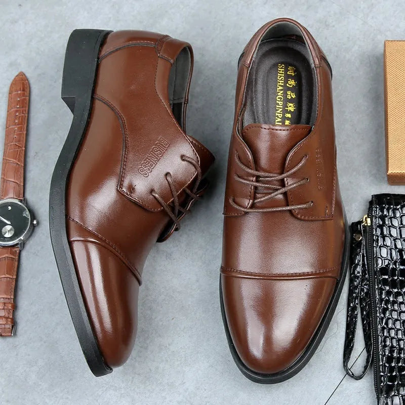 Men's black formal lace-up shoes with decorative stitching and horse buckle detail on rubber sole